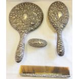 A silver brush and mirror vanity set. Hallmarked Birmingham 1927