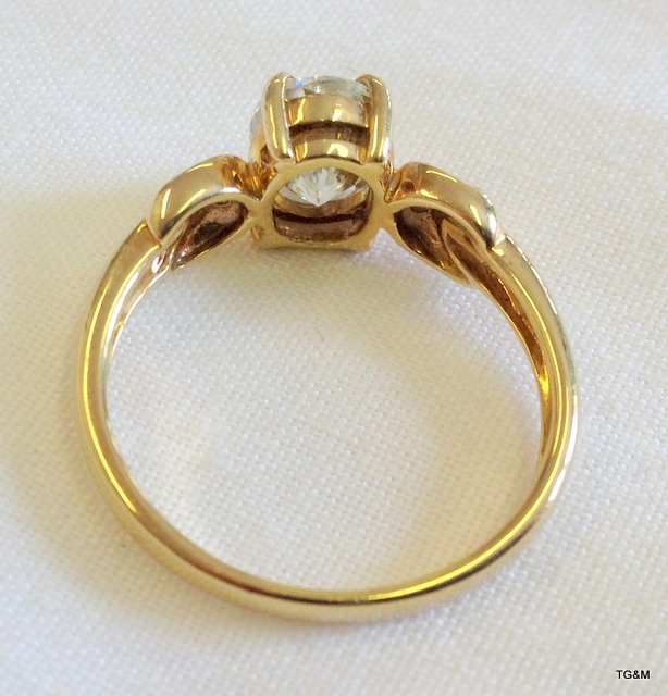 A gold ring set a large oval Moissanite (tests as a diamond) with diamond shoulders - Image 2 of 2