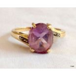 A ladies 9ct gold Amethyst and diamond ring size Q