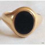 A 9ct gold mans signet ring size W