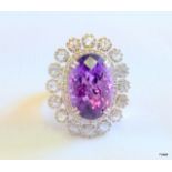An 18ct White gold Amethyst and Diamond Ring. Central Stone 15ct and 1ct of Diamonds