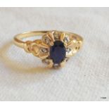 A ladies 9ct gold sapphire and diamond ring. size P