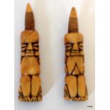 A pair of tribal art bone figures