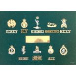 A display of badges with an engraved plaque Presented to Brigadier KH Olds from 71 Yeomanry Signal