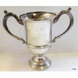 A solid silver trophy cup. London 1924 13oz weight 19cm high