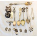 A collection of silver jewellery and spoons