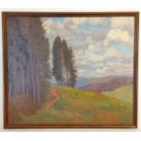 A framed oil on board of a wooded valley scene signed and dated 1918. Size 72 x 64cm