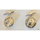 A Pair of Silver Cufflinks depicting Horses