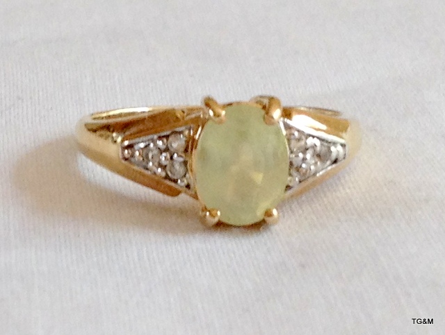 A ladies 9ct gold diamond shoulder ring size N