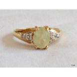 A ladies 9ct gold diamond shoulder ring size N