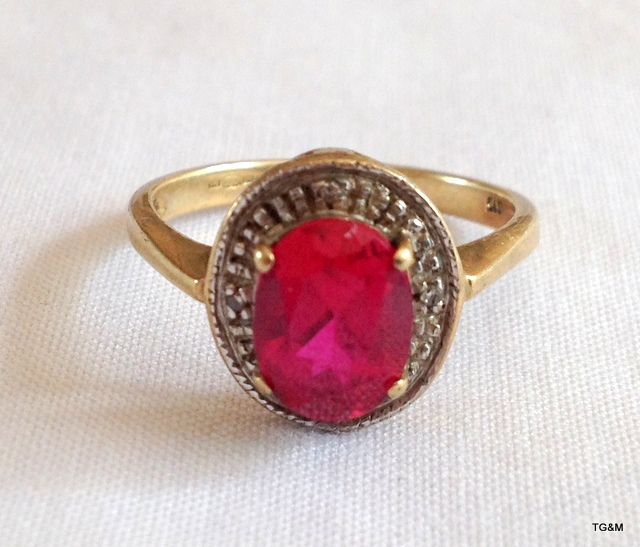 A 9ct gold ruby and diamond ring size K