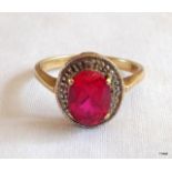 A 9ct gold ruby and diamond ring size K