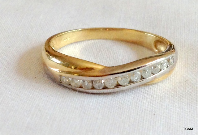 A 9ct gold ladies diamond crossover ring size Q