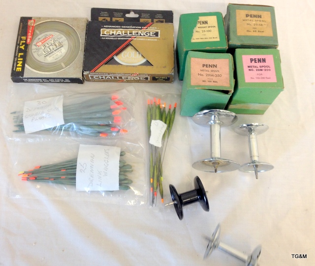 A collection of fishing floats, fly line and spools
