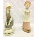 2 Nao porcelain figures 21cm high, Girl with a lamb and another of a boy with a prayer book