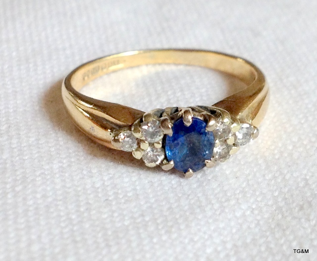 A ladies 9ct gold sapphire and diamond ring. size M/N