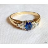 A ladies 9ct gold sapphire and diamond ring. size M/N