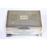 A hallmarked silver cigarette box engraved JSE from Officers NCOs & Airmen Station Defence Section