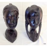 A pair of large carved African Tribal Art heads 27 x 12 x 17cm