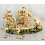 A carved Chinese bone group of fishermen 30cm long
