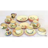 22 items of Devon Motto Ware (Torquay Ware) cups and saucers, plate and inkwell