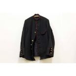 A Victorian Royal Marines Light Infantry tunic in black fabric with red piping