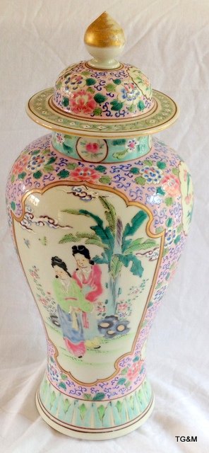 Chinese famille rose jar and cover. Pink ground with panels of figures and birds. 36cm high