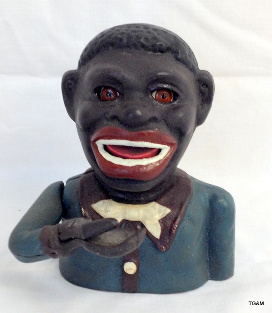 An American style cast iron money box 'Jolly Negro bank'