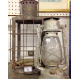 A hurricane lamp and an F A Schultz hanging lantern