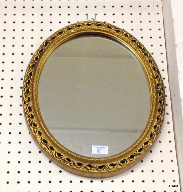 A gilded ornate wall mirror