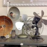 Two vintage fans and two vintage heat lamps