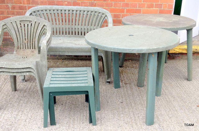 A collection of green plastic garden furniture