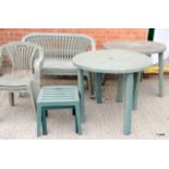 A collection of green plastic garden furniture