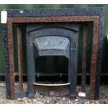 A wrought iron fire surround and fire grate