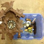 A mixed box of corkscrews and a cuckoo clock