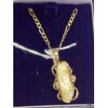 A 9ct gold mother of pearl  and diamond pendant and chain