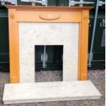 A light Oak framed marble fire surround and base. 115 x 122