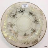 A frosted glass plate with sterling silver embellishments
