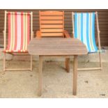 Two vintage deck chairs and a wooden garden table and chair