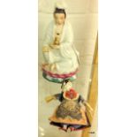 An Eastern porcelain figure and an Oriental doll