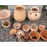 Two large terracotta pots and other teracotta garden pots