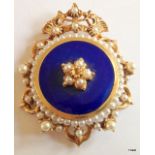 A gilt and enamel pearl brooch