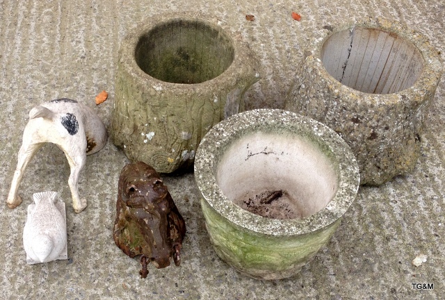 Three concrete garden planters, a cast iron horse head and other garden ornaments