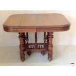 An Extendable park oak table with 2 non standard centre leaves 72 x 1720 open (1040 Closed) x 94