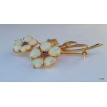 A 9ct gold and opal brooch in the form of flowers
