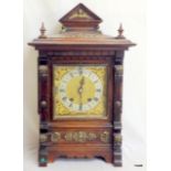 A German striking bracket clock in a mahogany case with brass mounts and brass face 47 x 30 x 21