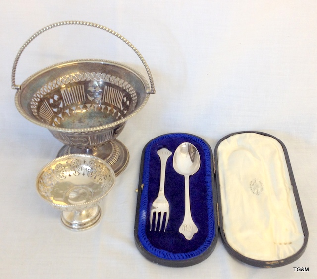 A silver boxed spoon and fork, silver bon bon and table basket