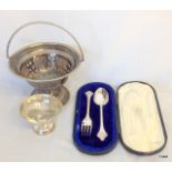 A silver boxed spoon and fork, silver bon bon and table basket