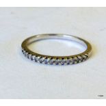 A 9ct white gold diamond1/2 eternity ring size M