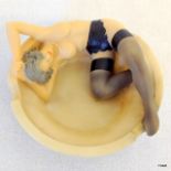 An ashtray depicting a 'Burlesque' Lady